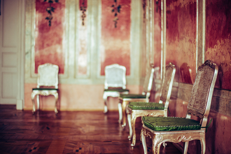 Old  antique vintage chairs in living room from Baroque.  Found in Latvia Rundale palace museum. Baroque style room.のeditorial素材