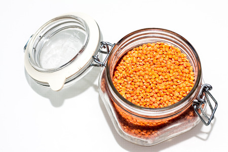 Orange Lentils in a glass jar. Red Chief Lentils are a medium size quick cooking lentilの写真素材