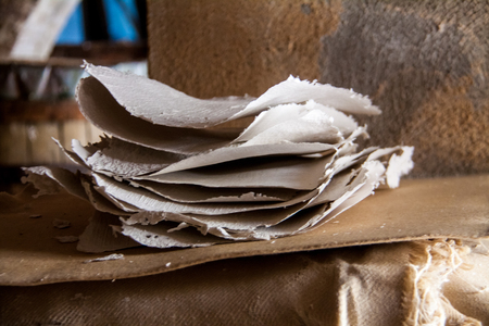 Stack of paper sheets in an ancient paper mill. Old traditional process of paper productionの写真素材