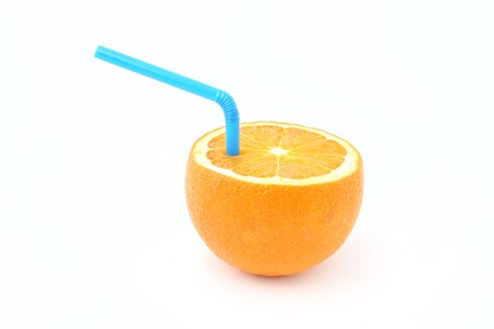 orange with straw isolated on whiteの写真素材