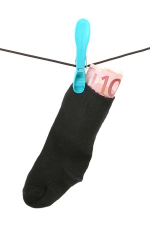 money in sock isolated on whiteの写真素材