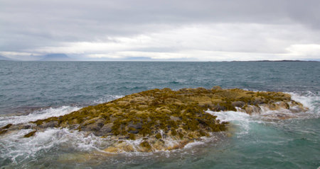 A view from wharf on some sea rocks in a bad weatherの写真素材