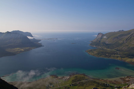 Beautiful landscape from bird view with some mountains, bay, ocean and riverside villageの写真素材