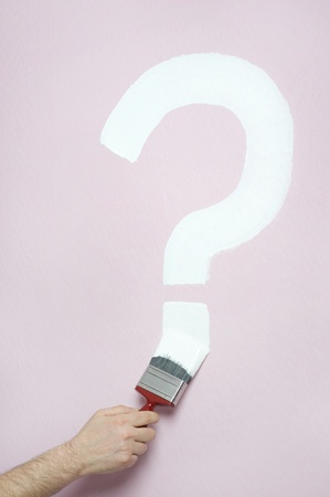 person paints a question markの写真素材