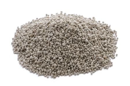 growmore fertiliser in a heap on a white backgroundの写真素材
