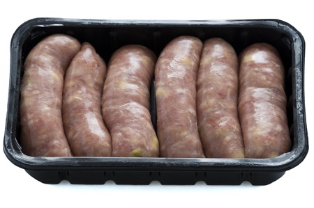 raw pork and apple sausages in a black plastic retail trayの写真素材