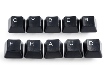 computer keys spelling the words cyber fraudの写真素材