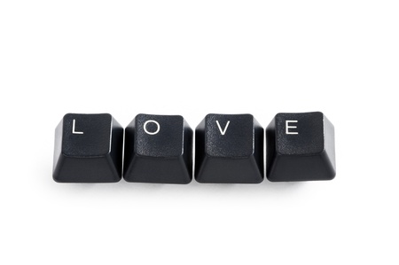 computer keys isolated on white spelling the word love の写真素材