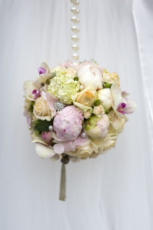 spherical wedding bouquet of flowersの写真素材