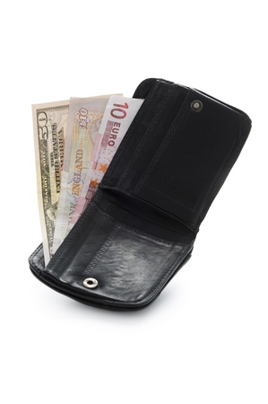 open wallet with dollar pound and euro notes isolated on whiteの写真素材