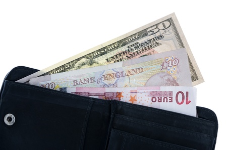 open wallet with dollar pound and euro notes isolated on whiteの写真素材