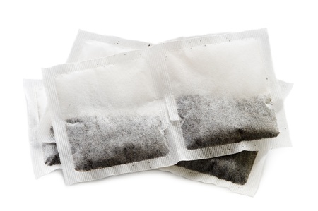 a heap of new tea bags isolated on a white backgroundの写真素材