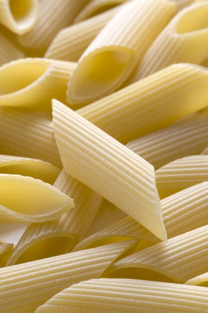 close up macro penne pasta uncooked dry full frameの写真素材