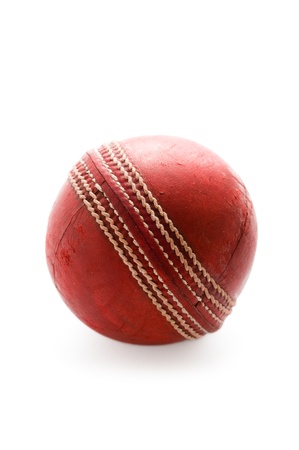 used cricket ball isolated on a white backgroundの写真素材