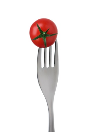 cherry tomato on a fork against a white backgroundの写真素材