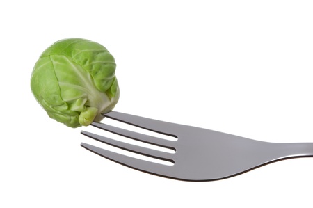 a single brussel sprout on a fork against whiteの写真素材