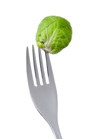 a single brussel sprout on a fork against whiteの写真素材
