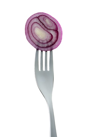 fresh red onion rings on a fork against white backgroundの写真素材