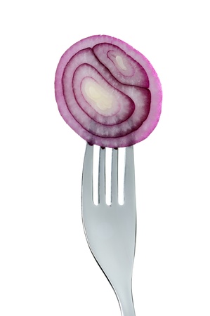 sliced red onion on a fork agaist white backgroundの写真素材