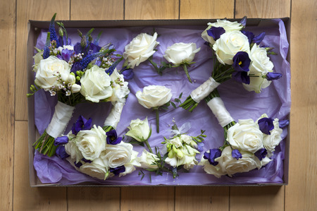 box of wedding flowers in white and purpleの写真素材