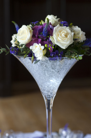wedding centrepiece flowers white and purpleの写真素材