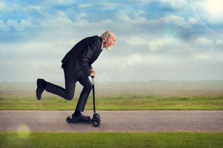 senior man riding a scooter active and energetic