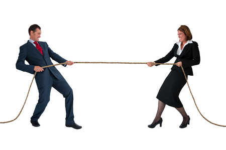 businessman and woman tug of war rivalry concept isolated on whiteの写真素材