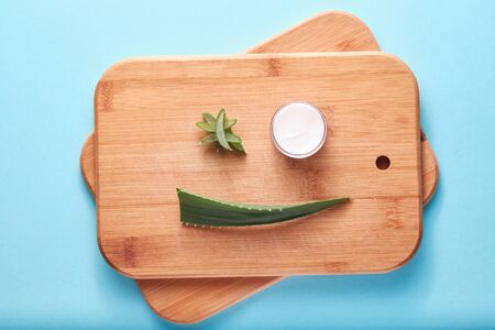 Aloe vera cream and leaf cuts, smiley face concept, healthcare, benefit for health, cosmetics, moisturizingの写真素材