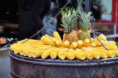 Street food at the main city fair Kebab, corn, grilled sausages