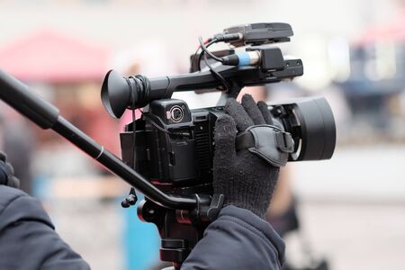 Video Making with the stabilizer. Man recording a video with a slr camcoder.の写真素材