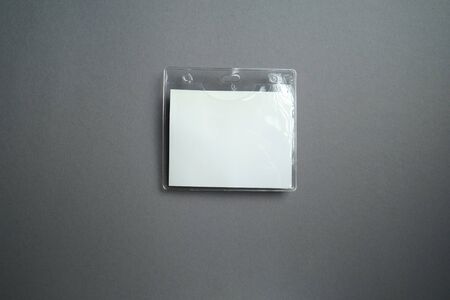 security badge lying on grey background with blank copy space for text addition, event invitation concept, text insertの写真素材