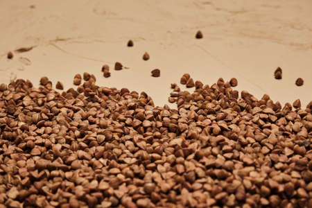buckwheat on a backdrop, selective focus. rustic buckwheat background.の写真素材