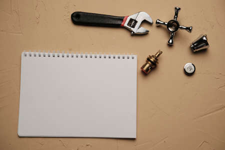 plumbing tools on a white sheet notepad, copyspaceの写真素材