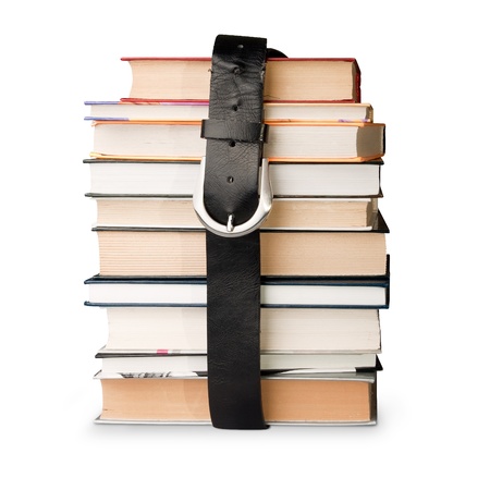 many books pile with black leather beltの写真素材