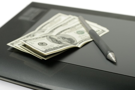Graphic tablet with pen and money close up shoot, selective focusの写真素材