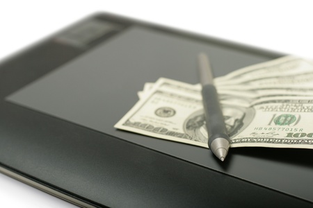 Graphic tablet with pen and money close up shoot, selective focusの写真素材