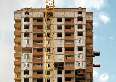 background with development and crane, against skyの写真素材