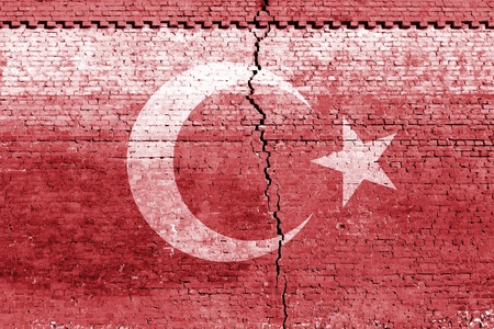 cracked brick wall as Turkey flag, symbolize the recent earthquakeの写真素材