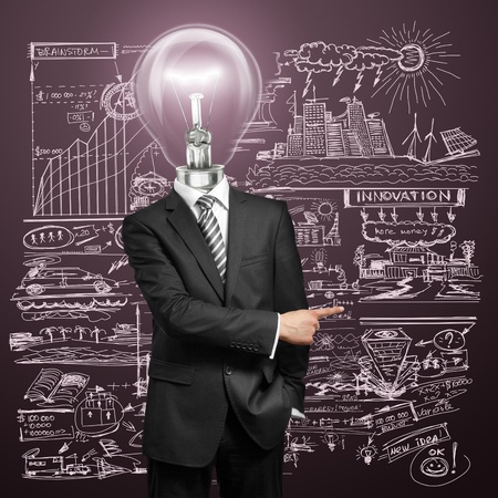 lamp head businessman have got an idea and showing with his finger to somethingの写真素材