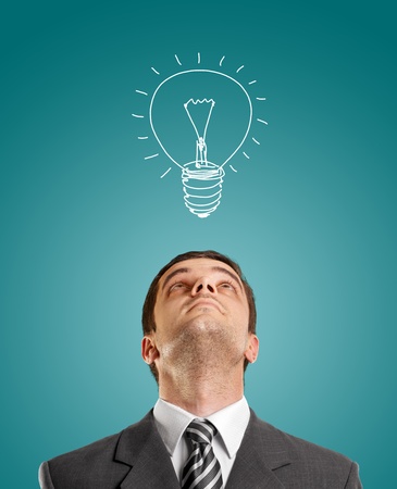 idea concept with businessman looking upwards, with suit and necktieの写真素材