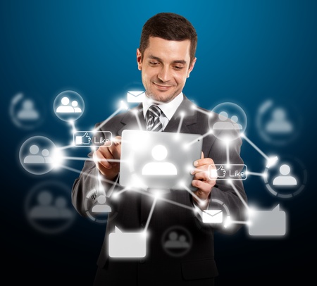 Social network concept, businessman with i pad in his handsのeditorial素材