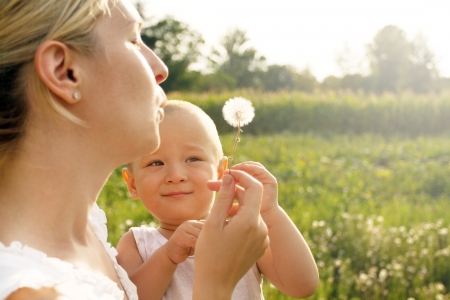 Family, mother and son playing and have fun outdoorsの写真素材