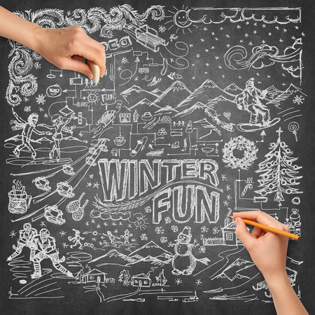 Idea winter fun background sketch and human hand with pencilの写真素材