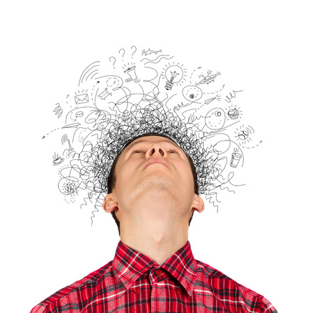 Thinking man with signs and light idea bulb aboveの写真素材