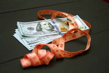 Dollars money cash on black background. Heap of money measurmentの写真素材