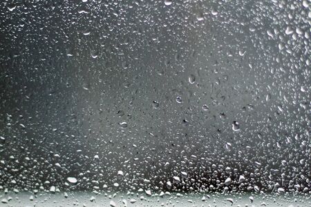 Raindrops on the glass. Water drops on the car window