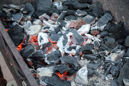 Hot coal with sparks. A barbecue in the open air. BBQ with coalsの写真素材