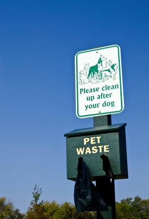 Reminder sign to clean up after your dogの写真素材