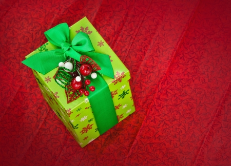 Christmas present on red background の写真素材