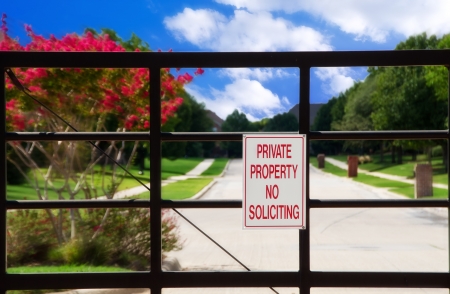 No soliciting sign at a gate